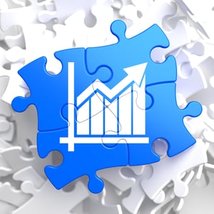 Growth Chart Located on Blue Puzzle Pieces. Business Concept.