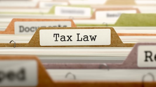 Tax Law - Folder Register Name in Directory. Colored, Blurred Image. Closeup View.